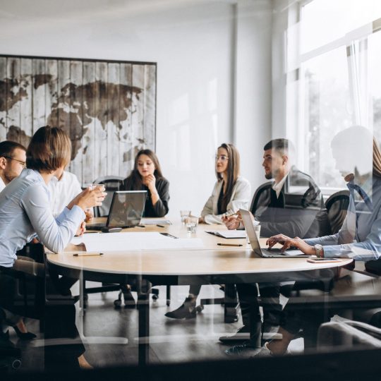 Group of people working out business plan in an office