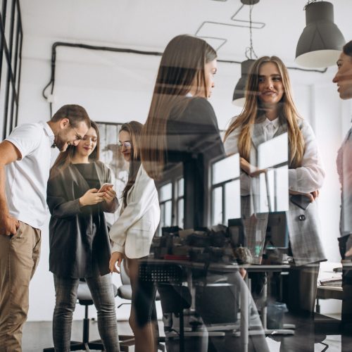 Group of people working out business plan in an office