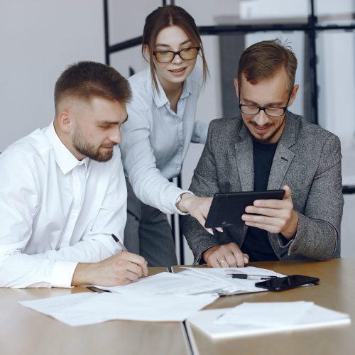 Man with a tablet. Business partners at a business meeting.People sitting at the table